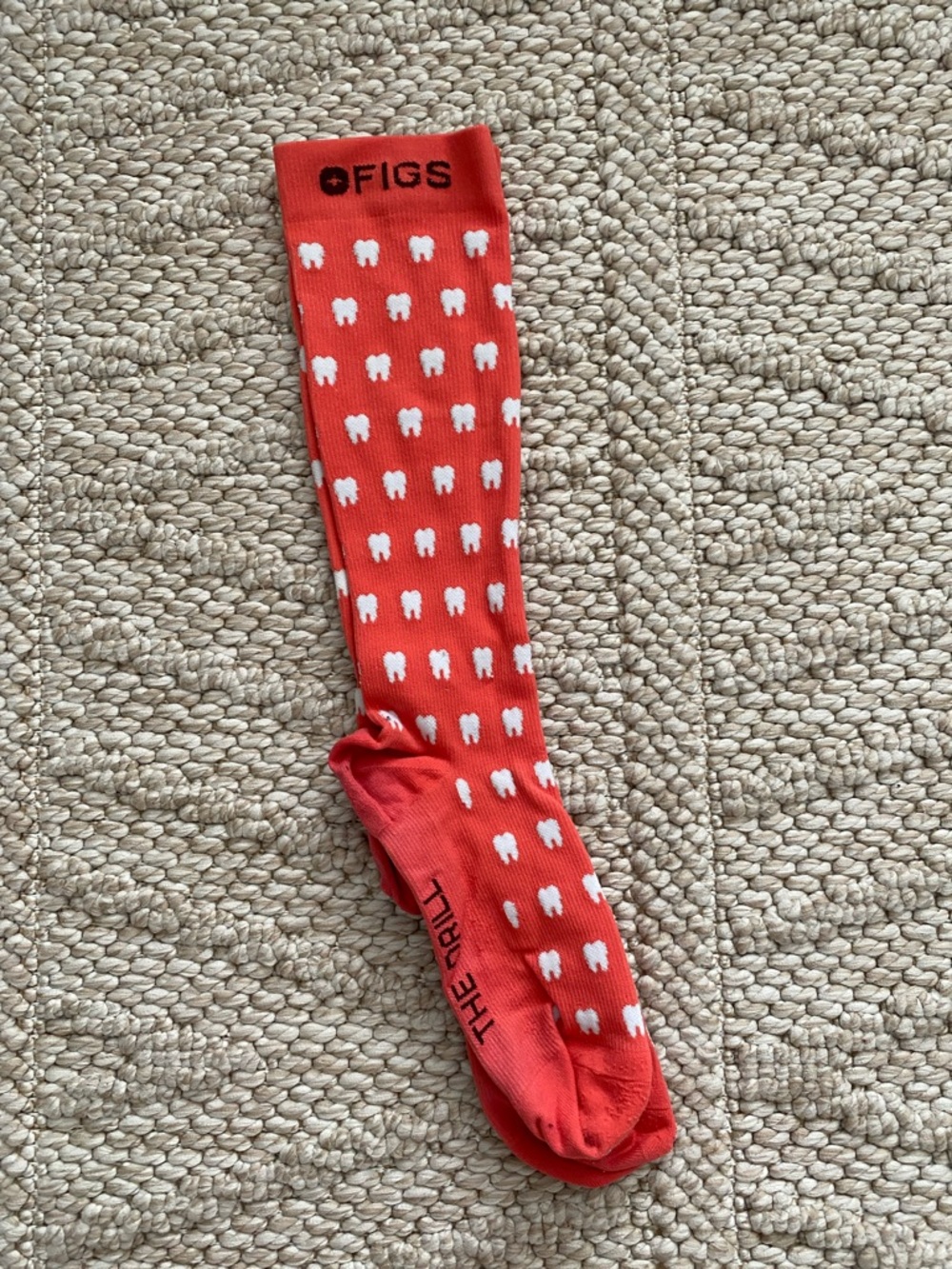 FIGS coral Sock with White Tooth Pattern